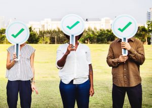 Types of SEO represented by 3 people holding signs