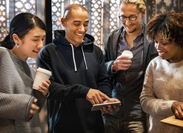 man sharing content on his smartphone with friends